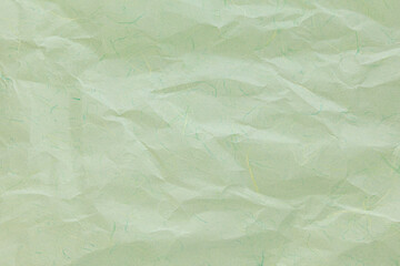Hanji, an eco-friendly paper made from Broussonetia kazinoki. Crumpled,  Light green Korean paper in pastel tones