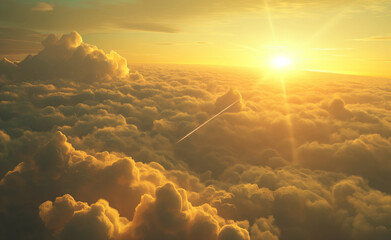 Golden sunrise over a sea of clouds with an airplane contrail.
