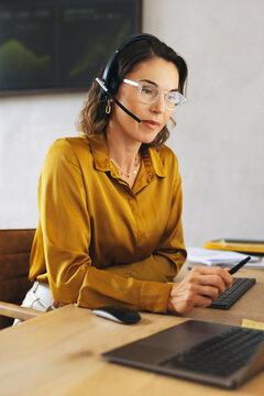 Female call center agent providing technical support to customers