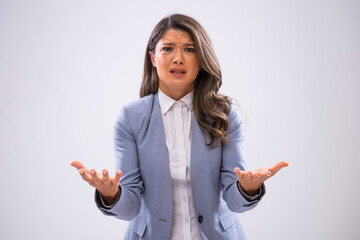 Portrait of frustrated businesswoman who is looking at camera in disbelief.