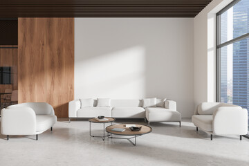 Stylish office lounge zone interior with soft place near window. Mockup wall