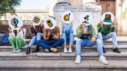 Students holding education icons on campus: diversity in STEM subject