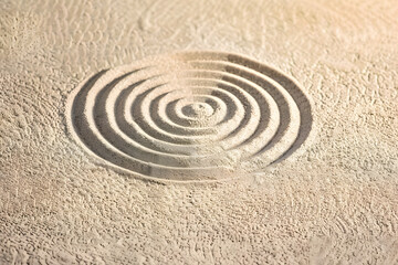 A circle in the sand. Zen Japanese garden. Background.