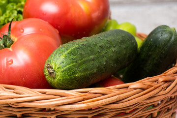 Fresh vegetables in basket. Tomato, cucumber, pepper