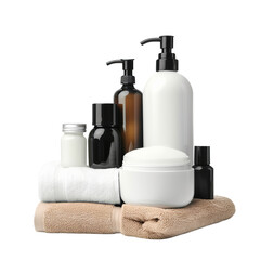 A collection of toiletries and lotions are displayed on a white towel