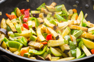 Cooking different veggies in frying pan