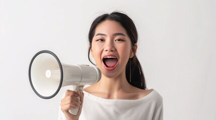 Naklejka premium Euphoric Asian lady loudly declaring positive update or advancement alone on blank backdrop.