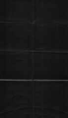 Fototapeta premium texture scan of folded black paper, cool poster overlay element.