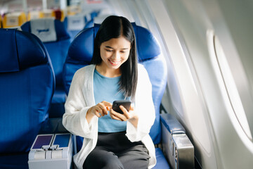 Asian Woman Working on Tablet During  in first class, multitasking with Flight Travel in style, work
