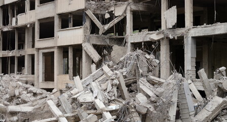 Close-up of destroyed city multi-storey residential building. Ruined apartments. Russias war against Ukraine