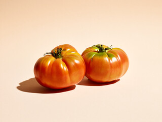 natural farm tomatoes on a beige background