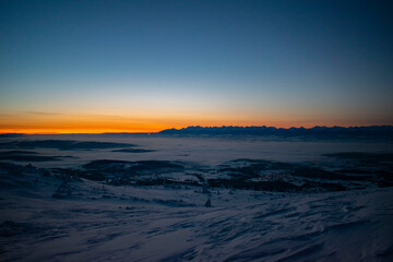 sunrise over the Tatra Mountains and snowy mountain peaks