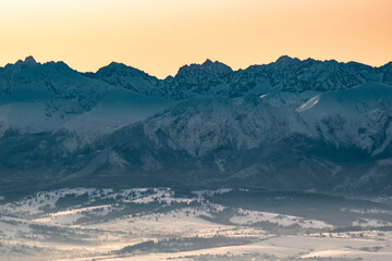sunrise over the Tatra Mountains and snowy mountain peaks © Wojciech
