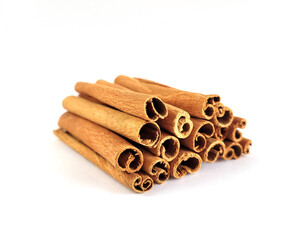 Closeup of cinnamon sticks on white background