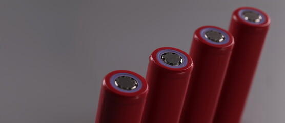 Close-up of four rechargeable batteries set, lithium battery and important power source. Battery...