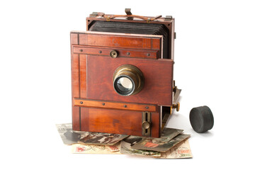 Vintage film photo-camera and old family photos .