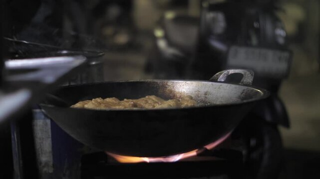 close up of hand frying cakwe or Yu Char Kway