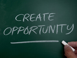 Obraz premium Create opportunity, word text written on chalkboard, motivational inspirational quote