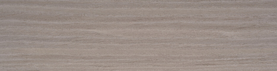 Fototapeta premium Gentle gradients of gray and muted earth tones cascade across the sturdy ash wood veneer, offering a canvas of understated elegance