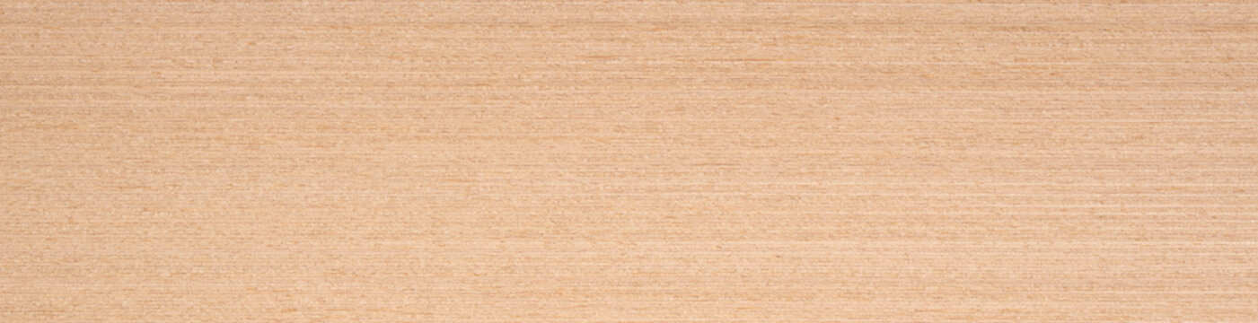 Subtle shades of beige and cream interweave across the smooth expanse of this beechwood veneer