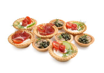 Delicious canapes with dry smoked sausages, jamon and pate isolated on white