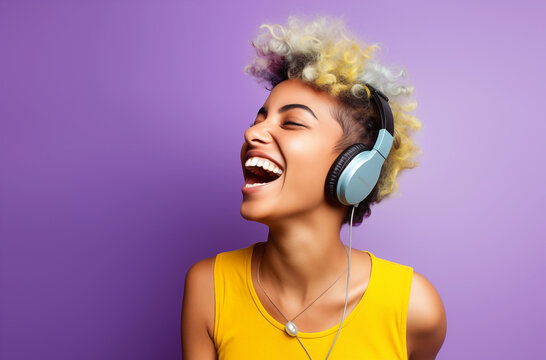 Young Woman With Colorful Hair And Headphones Laughing Against A Vibrant Purple Background