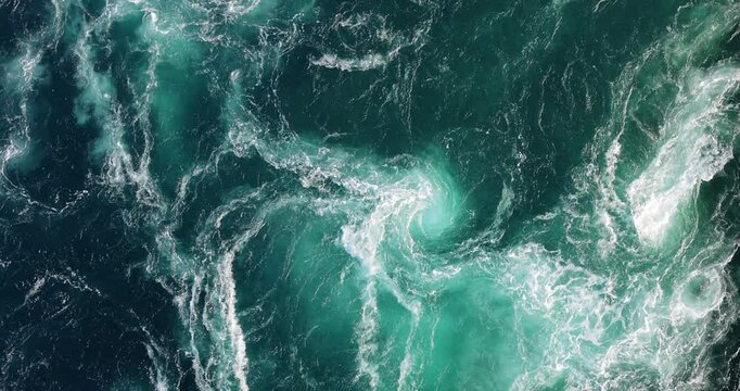Blue waves of water of the river and the sea meet each other during high tide and low tide.