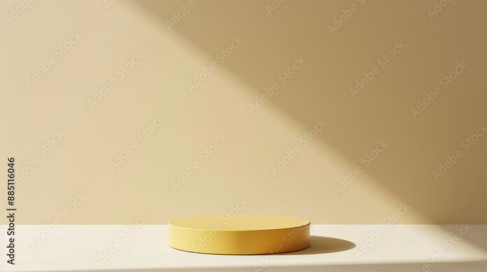 Aufkleber a round yellow platform sits on a white surface in front of a light beige wall. sunlight streams in 