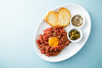 Traditional steak tartare with egg yolk