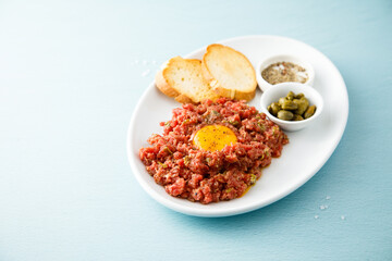 Traditional steak tartare with egg yolk