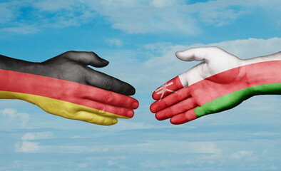 Oman and Germany country handshaking with flags, consensus concept international co-operation...