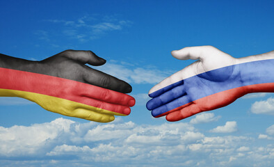 Russian Federation and Germany country handshaking with flags, consensus concept international...