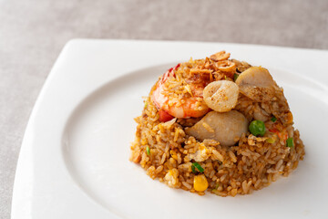 Asian fried rice (Indonesian: nasi goreng) with squid, prawns, and fish baso
