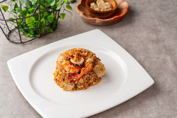 Asian fried rice (Indonesian: nasi goreng) with squid, prawns, and fish baso