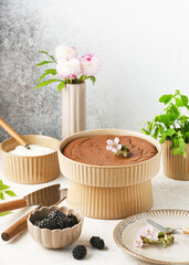 Delicious fresh homemade dark chocolate cake in a ceramic baking pan. Sweet food concept. Selective focus. Copy space.