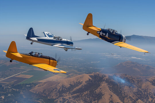 Vintage warbirds perform aerobatic maneuvers over a mountainous landscape, showcasing their flight skills. National Aviation Day