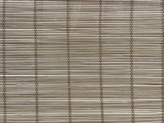 The scene is made of bamboo. Background of dried bamboo tied. Textured background.