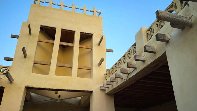 b roll wide view of traditional old house in Arabian culture windcatcher ventilation architectural passive design rural village countryside in Iran local people life seaside beach coastal town summer