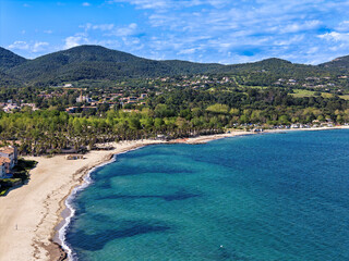 Beach with waves in Port Grimaud looking towards Saint Maxime in France in spring, close-up