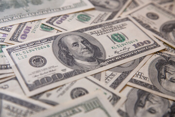Background of one hundred dollar bills. Close-up. Top view.