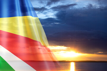 Flag of Seychelles against the sunset. Background for National Holidays