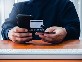 Add credit card, financial, online payment technology concept. Add credit cash or debit card icon appear while man using mobile smartphone to add payment method to link wallet on app for pay directly.
