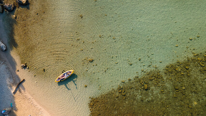 Family kayaking, mother and daughter paddling in kayak on Mediterranean sea canoe tour, having fun, outdoor activities with children in Greece. Water fun during school vacation. Top view.