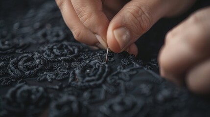 Focused hands working delicately on sewing intricate black lace, showcasing detailed craftsmanship and precision, representing an art of creating beautiful textile designs.