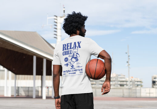 Mockup Of Man Wearing Customized T-Shirt With Basketball