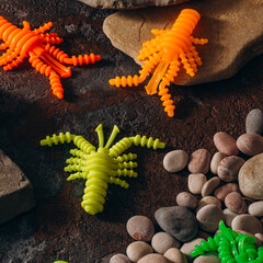 silicone trout fishing lures lie on the rocks