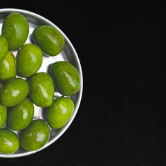 raw green mangoes in a plate
