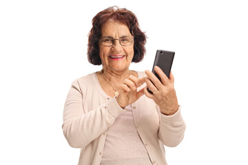 Elderly woman typing on a phone and smiling