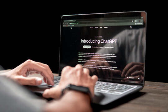 Close up view of the Chat GPT AI website on a laptop screen operated by an adult man. Selective focus, soft focus