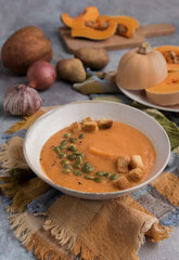 Bowl with pumpkin cream with nuts